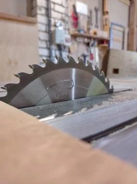 Close-up of a circular saw's cutting blade in a carpentry shop Stock Photos