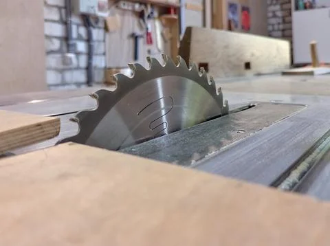 Close-up of a circular saw's cutting blade in a carpentry shop Stock Photos