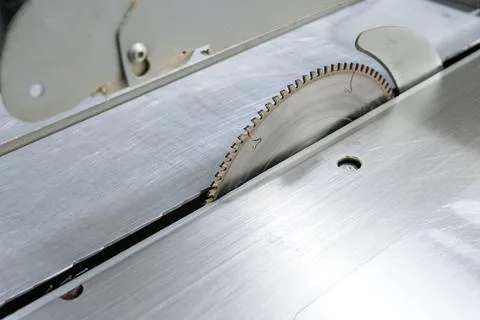 Close up of circular table saw blade in industrial woodworking workshop Stock Photos