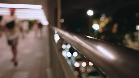 Close up of city elevated Skywalk Handrail with blurred unrecognizable Stock Footage 315018035