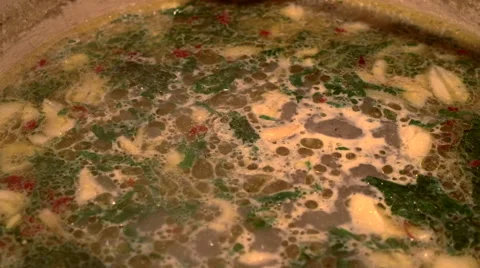 Close up of clams and broth being stirred Stock Footage 40285187