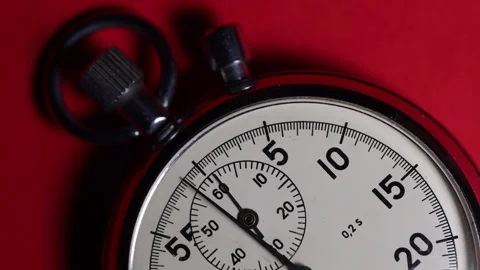 Close up of classic antique stopwatch on a red background Video stock 325216865