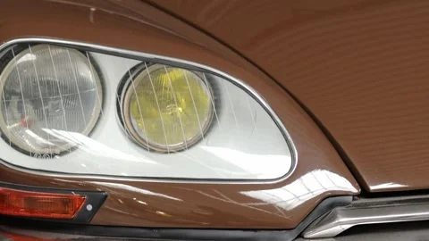 Close-up of classic brown car headlights, showcasing vintage automotive design Stock Footage 308159961