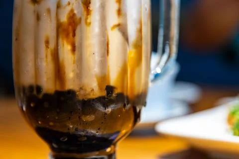 A close-up of classic brown sugar bubble tea with images of a crystal-clear.. Stock-Fotos