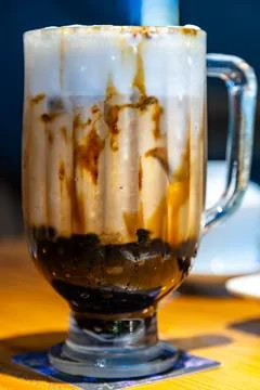 A close-up of classic brown sugar bubble tea with images of a crystal-clear.. Fotos Stock