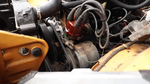 Close-up of a classic car engine running with the distributor, ignition wires Stock Footage 340327565