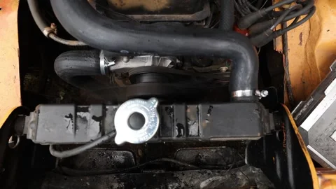 Close-up of a classic car engine running with the distributor, ignition wires Stock Footage 340327617