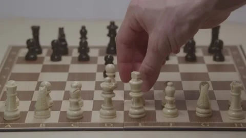 Close-up of a classic chess game being played on a wooden board. Stock Footage 327208929