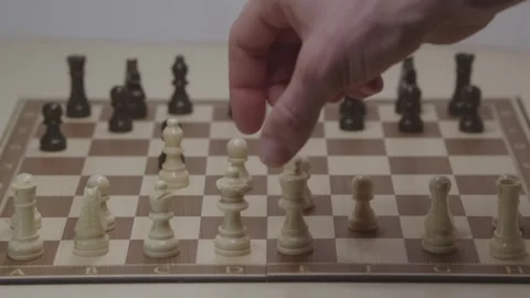 Close-up of a classic chess game being played on a wooden board. Stock Footage 327208932