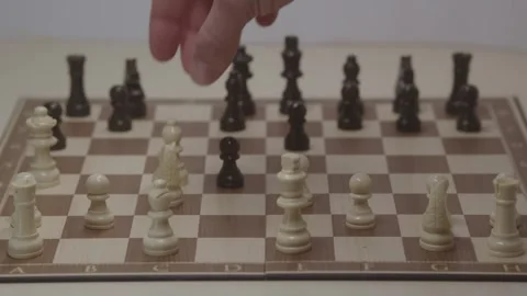 Close-up of a classic chess game being played on a wooden board. Stock Footage 327208991