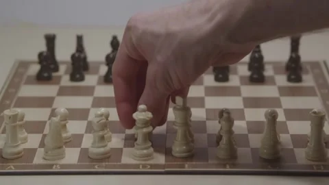 Close-up of a classic chess game being played on a wooden board. Stock Footage 327209056