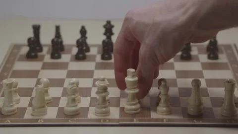 Close-up of a classic chess game being played on a wooden board. Stock Footage 327209062