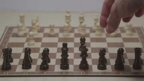 Close-up of a classic chess game being played on a wooden board. Stock Footage 327209086