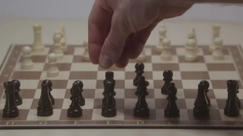 Close-up of a classic chess game being played on a wooden board. Stock Footage 327209099
