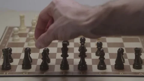 Close-up of a classic chess game being played on a wooden board. Stock Footage 327209187