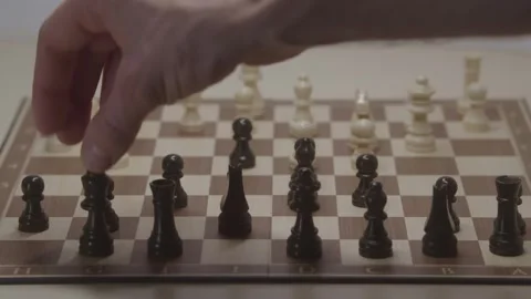 Close-up of a classic chess game being played on a wooden board. Stock Footage 327209715