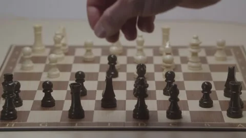 Close-up of a classic chess game being played on a wooden board. Stock Footage 327209717