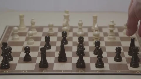 Close-up of a classic chess game being played on a wooden board. Stock Footage 327209834