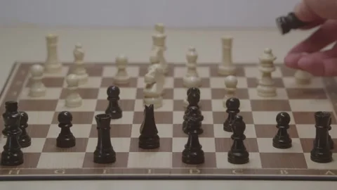 Close-up of a classic chess game being played on a wooden board. Stock Footage 327209853