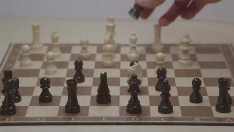 Close-up of a classic chess game being played on a wooden board. Stock Footage 327210066