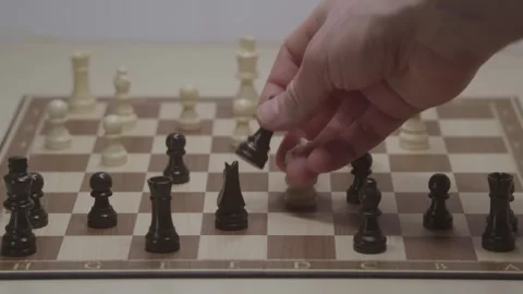 Close-up of a classic chess game being played on a wooden board. Stock Footage 327210159