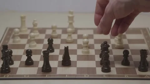 Close-up of a classic chess game being played on a wooden board. Stock Footage 327210181