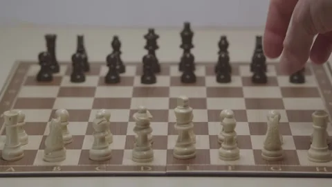 Close-up of a classic chess game being played on a wooden board. Stock Footage 327210528