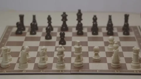 Close-up of a classic chess game being played on a wooden board. Stock Footage 327210641