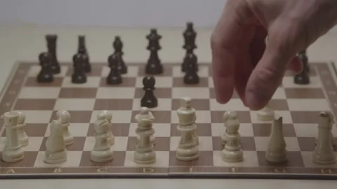 Close-up of a classic chess game being played on a wooden board. Stock Footage 327210704