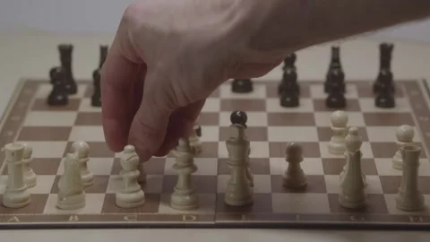 Close-up of a classic chess game being played on a wooden board. Stock Footage 327210785