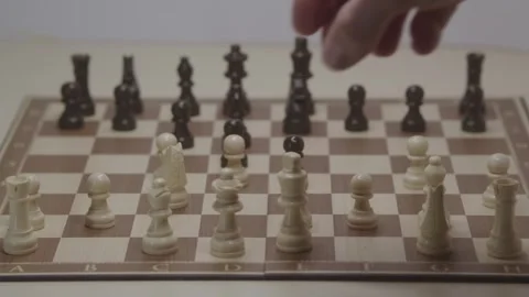 Close-up of a classic chess game being played on a wooden board. Stock Footage 327211175