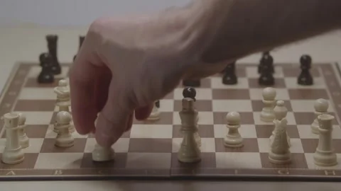 Close-up of a classic chess game being played on a wooden board. Stock Footage 327211221