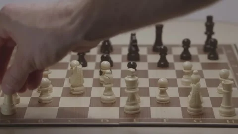 Close-up of a classic chess game being played on a wooden board. Stock Footage 327211322