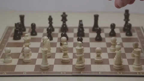 Close-up of a classic chess game being played on a wooden board. Stock Footage 327211503