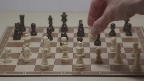 Close-up of a classic chess game being played on a wooden board. Stock Footage 327211558