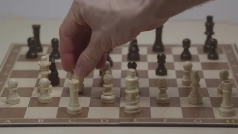 Close-up of a classic chess game being played on a wooden board. Stock Footage 327211589
