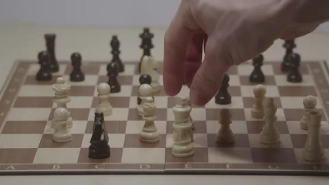 Close-up of a classic chess game being played on a wooden board. Stock Footage 327211640