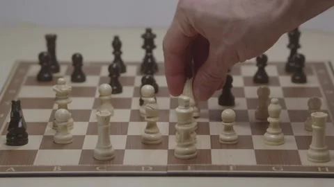 Close-up of a classic chess game being played on a wooden board. Stock Footage 327211660