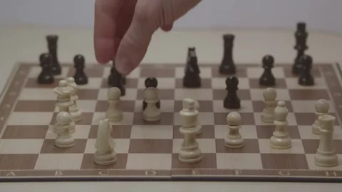 Close-up of a classic chess game being played on a wooden board. Video stock 327211778