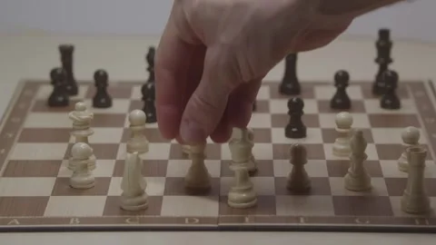 Close-up of a classic chess game being played on a wooden board. Stock Footage 327211827