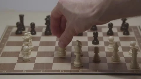 Close-up of a classic chess game being played on a wooden board. Video stock 327211836