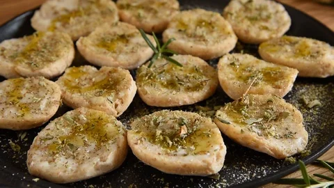 Close up of classic Italian bruschettas, cheese and oregano on croutons Video stock 128525853