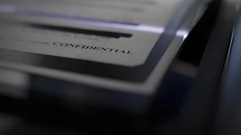 Close up on classified sensitive document report scanned to computer or copied Видео 313296669
