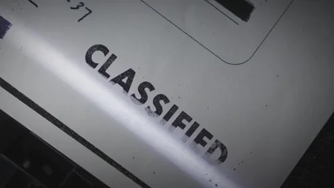 Close up on Classified stamp on secret document as scanner scans the file Stock Footage 313296459