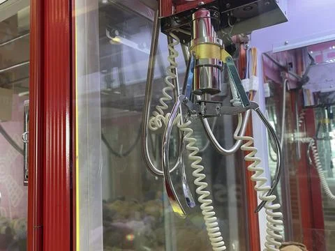 Close-Up of Claw Machine Arcade Game Stock Photos