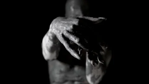 Close-up of clay-smeared hands. in the background, a woman is seen out of focus 動画素材 199198627