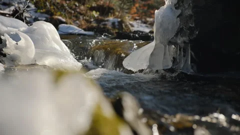 Close up of clean river water flowing during sunny winter day with foamy Stock Footage 301366129