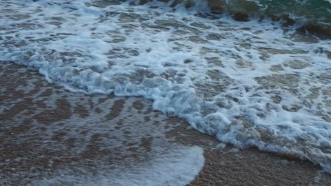 Close up of clean sea waves breaking on sandy beach with Sunset Stock Footage 157478269