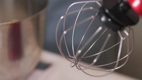 Close-up of a clean whisk mounted on a red planetary mixer. Stock Footage 147715250
