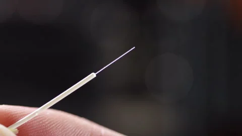 Close-up of a cleaned and cleaved optical fiber, ready for connector insertion Stockbeeldmateriaal 312358827